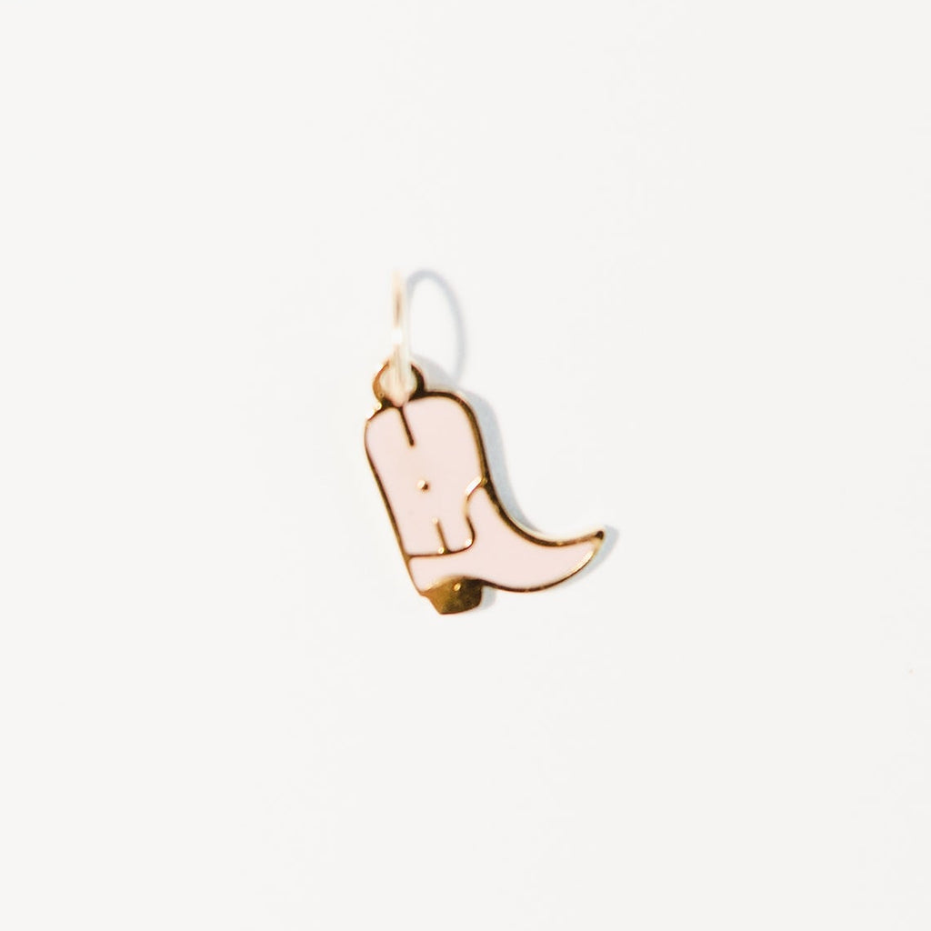 pink cowboy boot charm on a white background